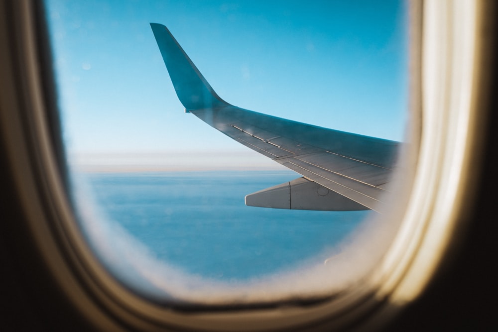 white airplane wing during daytime