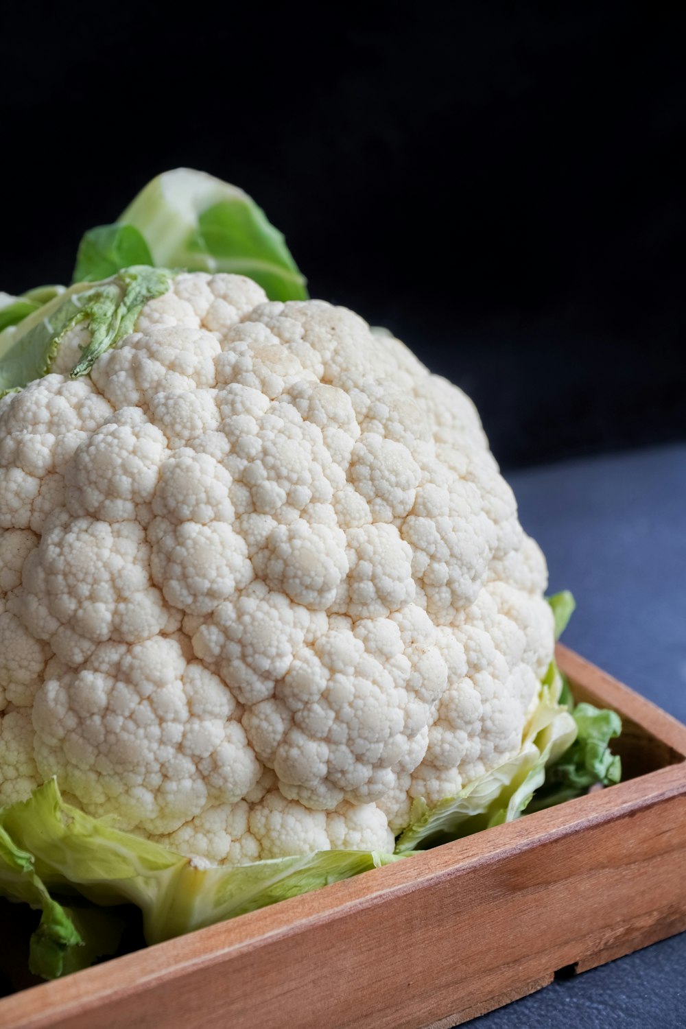 white cauliflower on black textile