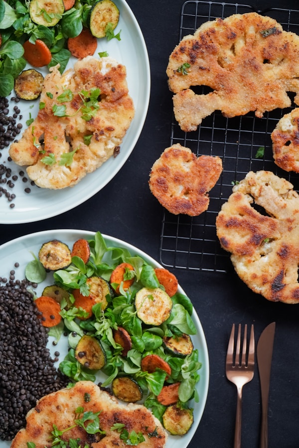 Fried food with green vegetable on white ceramic plate