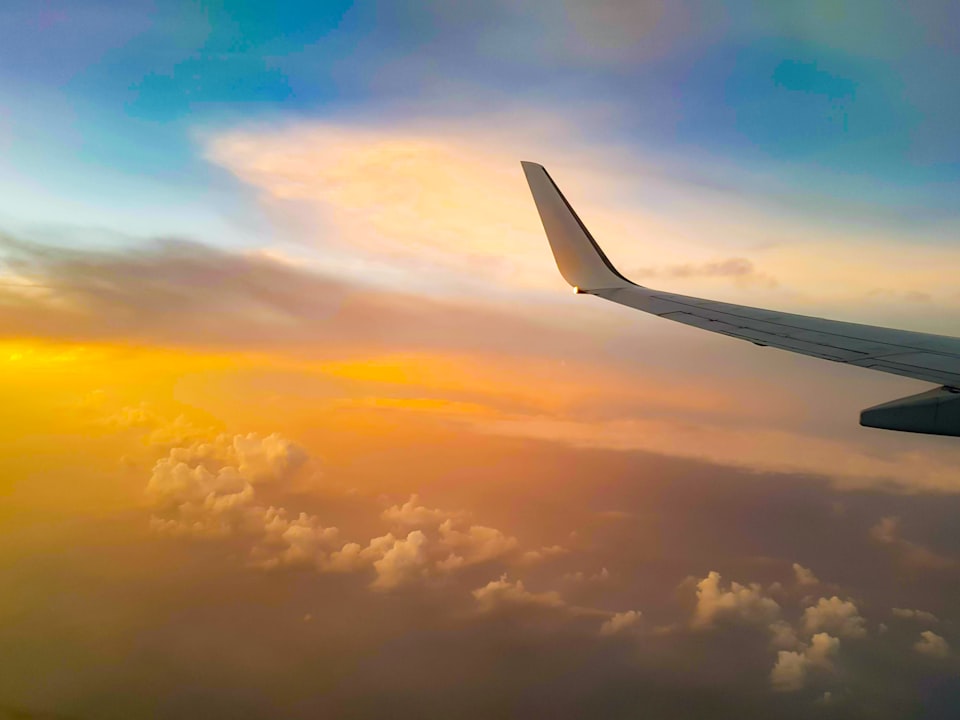 View of sunset and airplane winglet