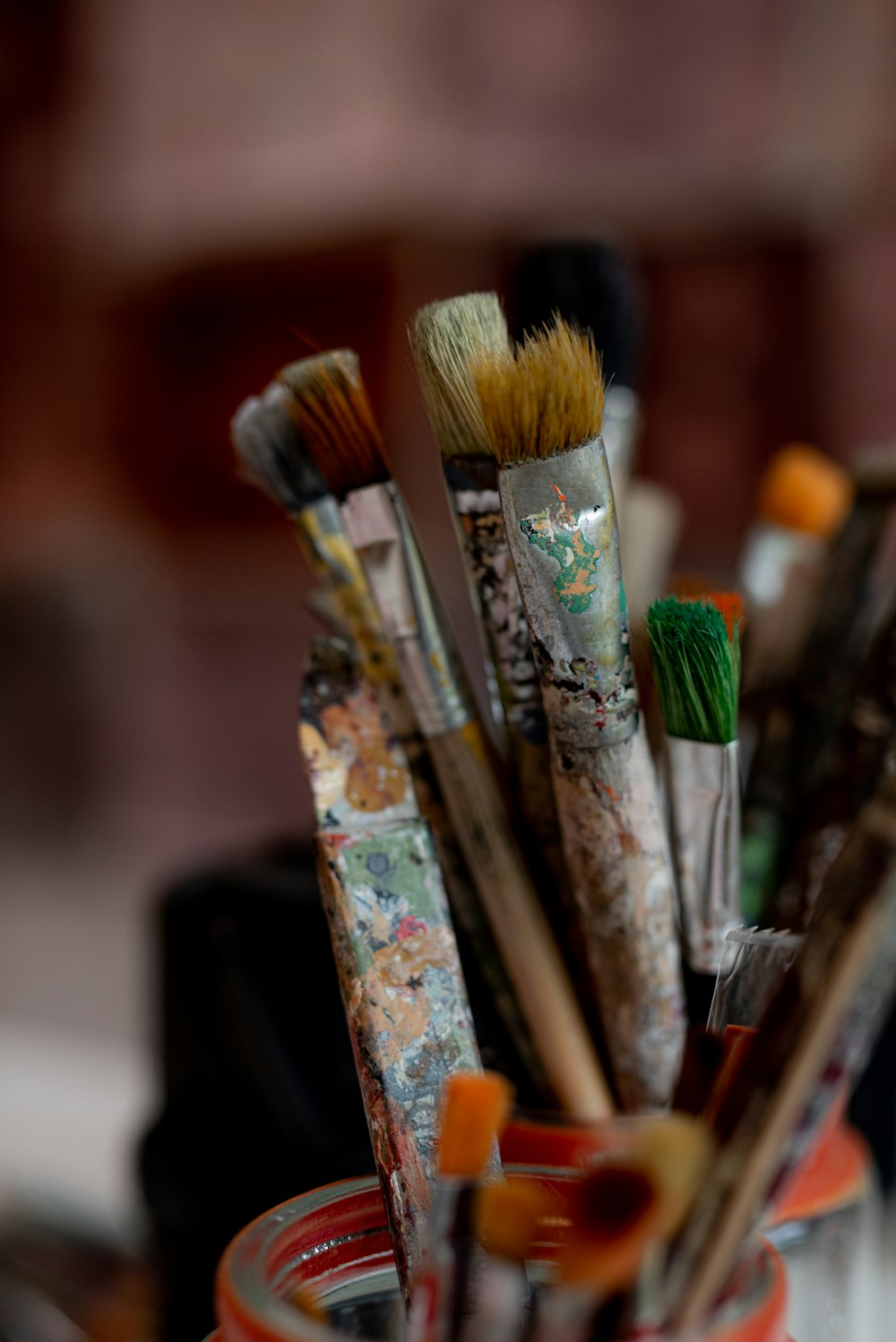 selective focus photography of paint brushes