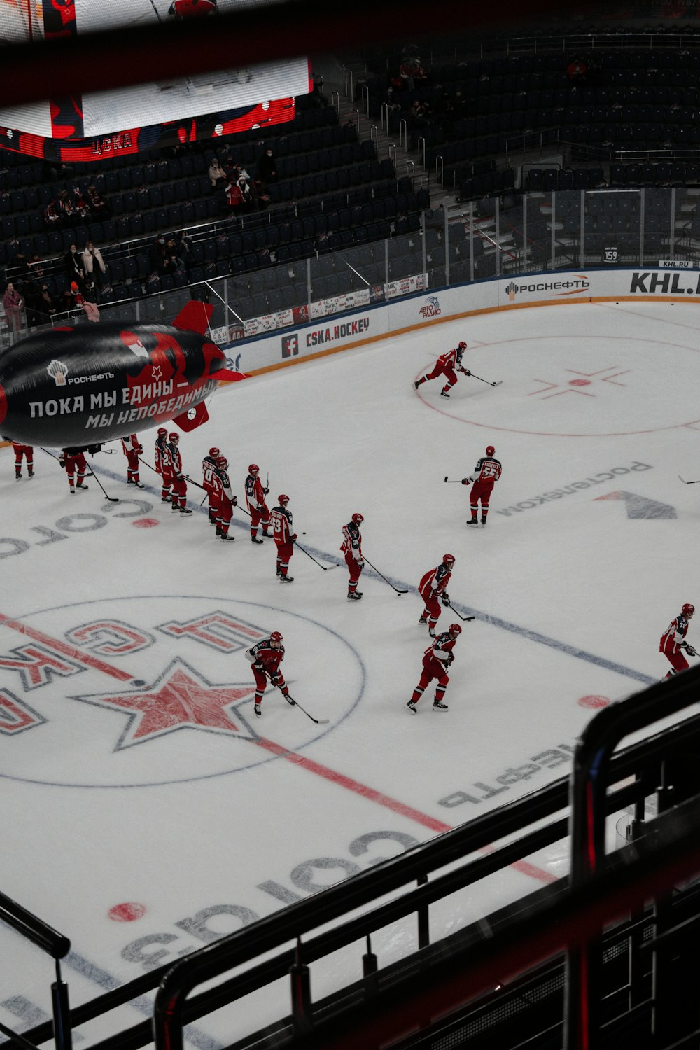 people playing ice hockey on stadium