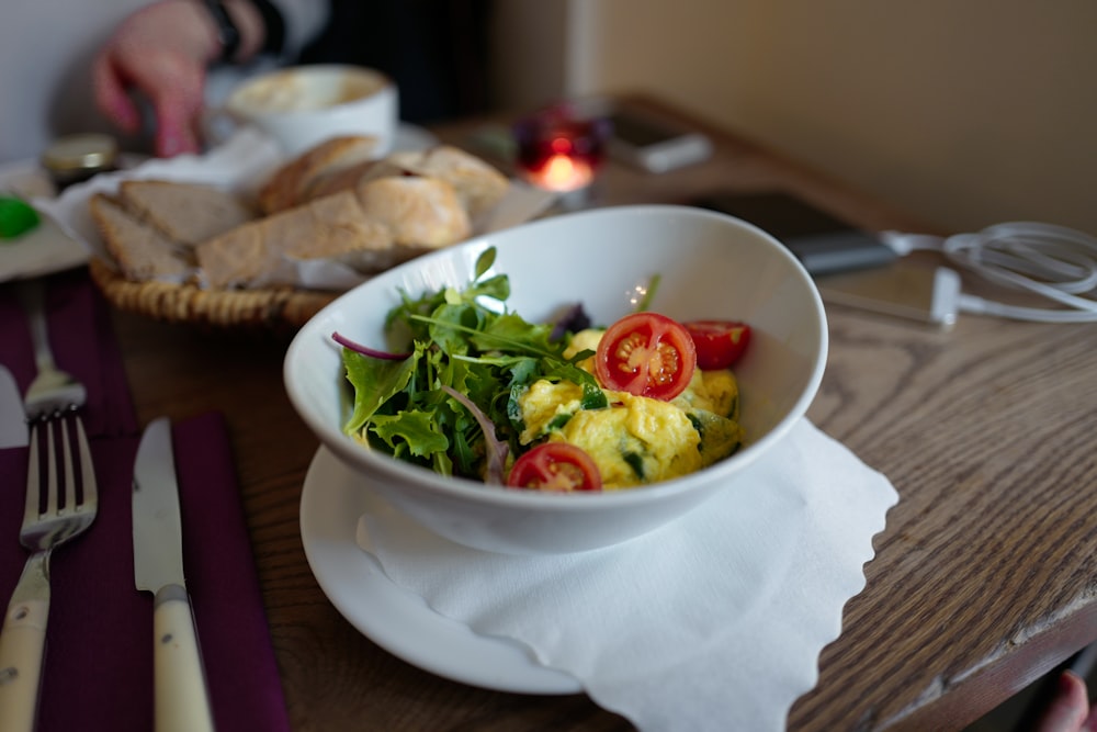 vegetable salad on white ceramic bowl