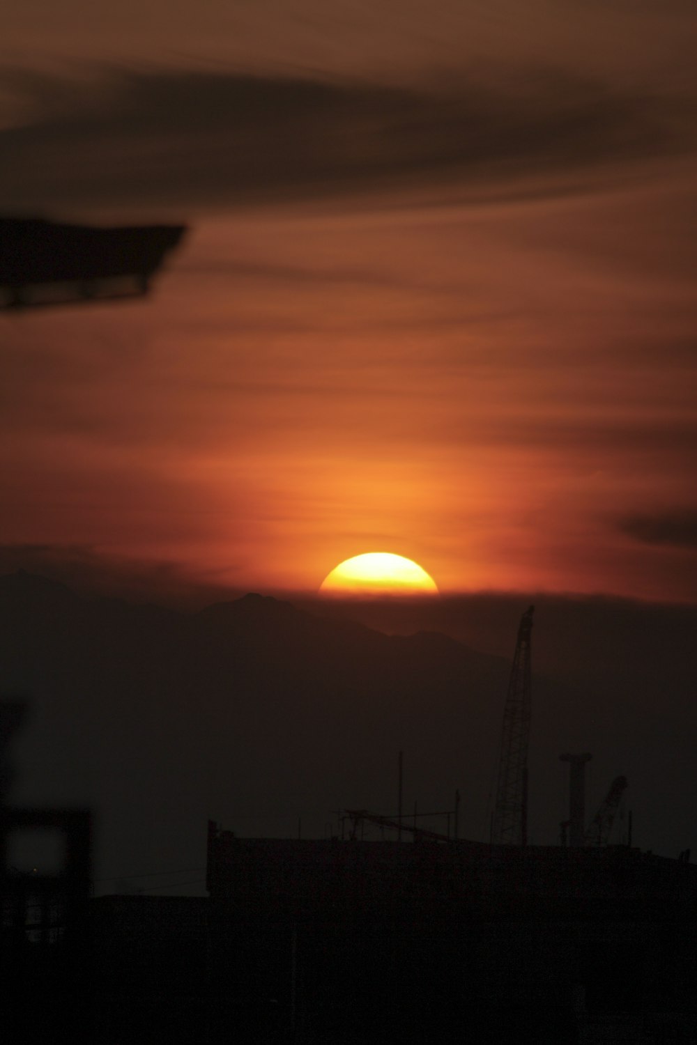 silhouette of house during sunset