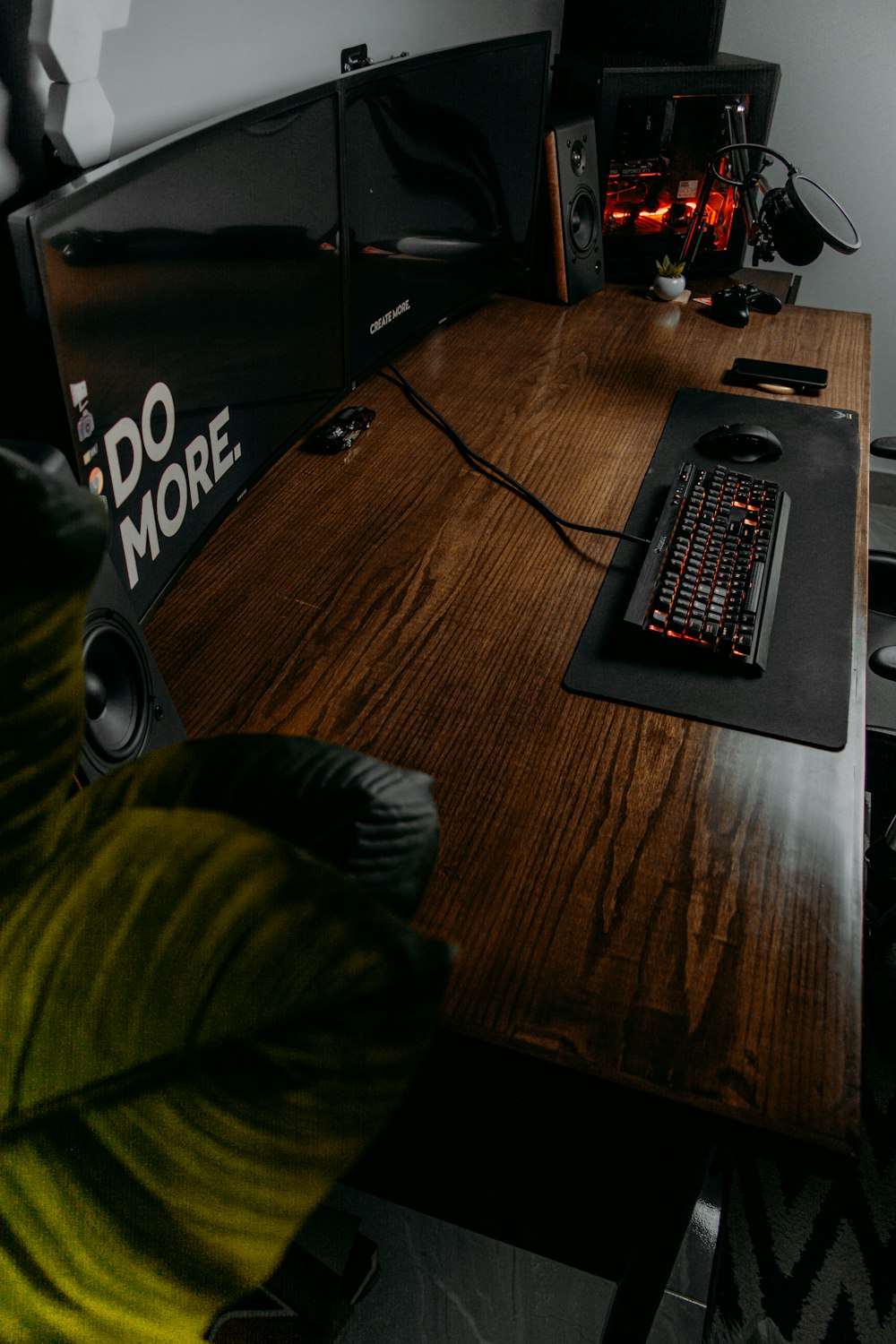 black and red computer keyboard on brown wooden table