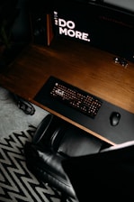 black computer keyboard on brown wooden desk