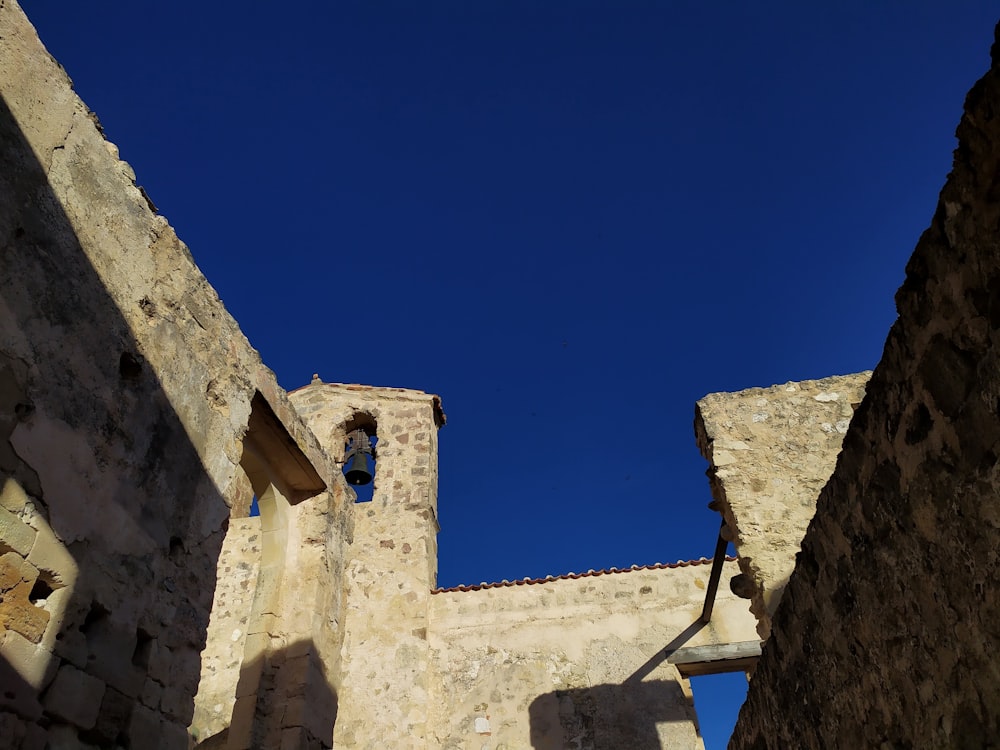 brown concrete building under blue sky during daytime