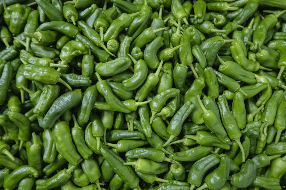 green chili peppers on green leaves