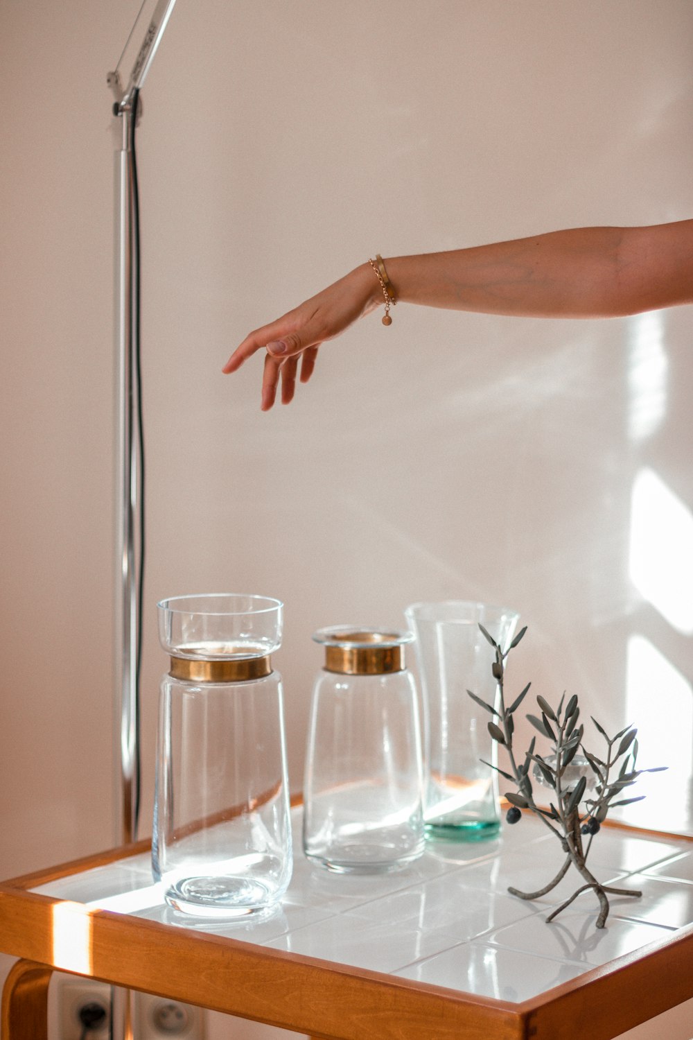 person holding clear drinking glass