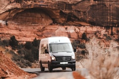 gray volkswagen golf on brown dirt road during daytime