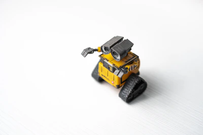 A sleek, modern robotic toy designed for children, glowing softly with LED lights.