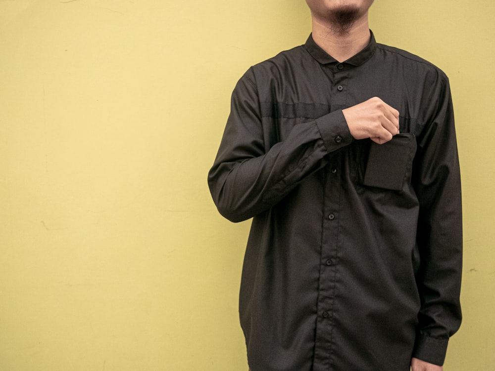 man in black button up long sleeve shirt