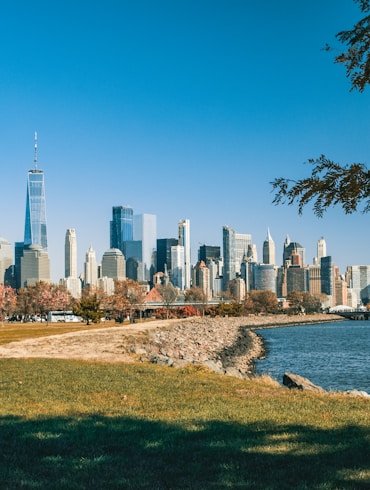 city skyline near body of water during daytime