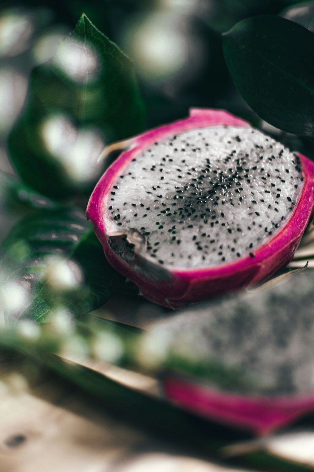 a close up of a dragon fruit on a table