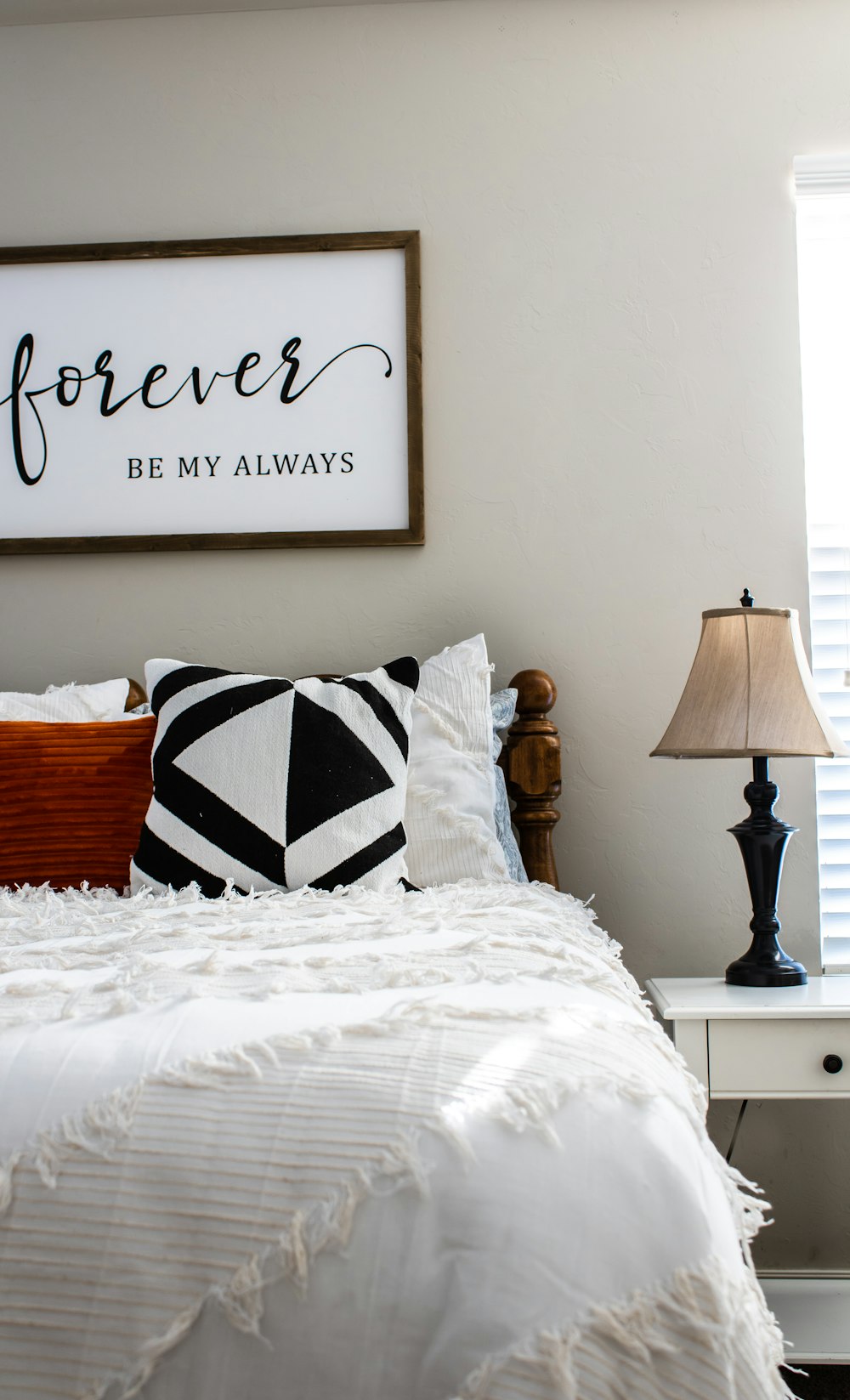 red and white throw pillows on bed