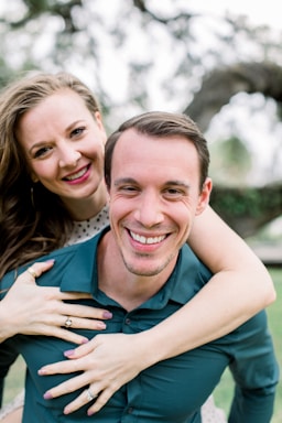 photography poses for couples,how to photograph model alex sanfilippo and alecia sanfilippo @ podpros.com; woman in blue sleeveless shirt smiling beside woman in white and black polka dot tank top