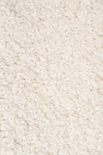 A close-up of a bowl filled with uncooked rice grains.