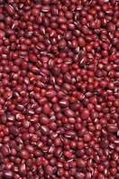 red round fruits on white surface