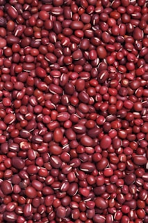 red round fruits on white surface