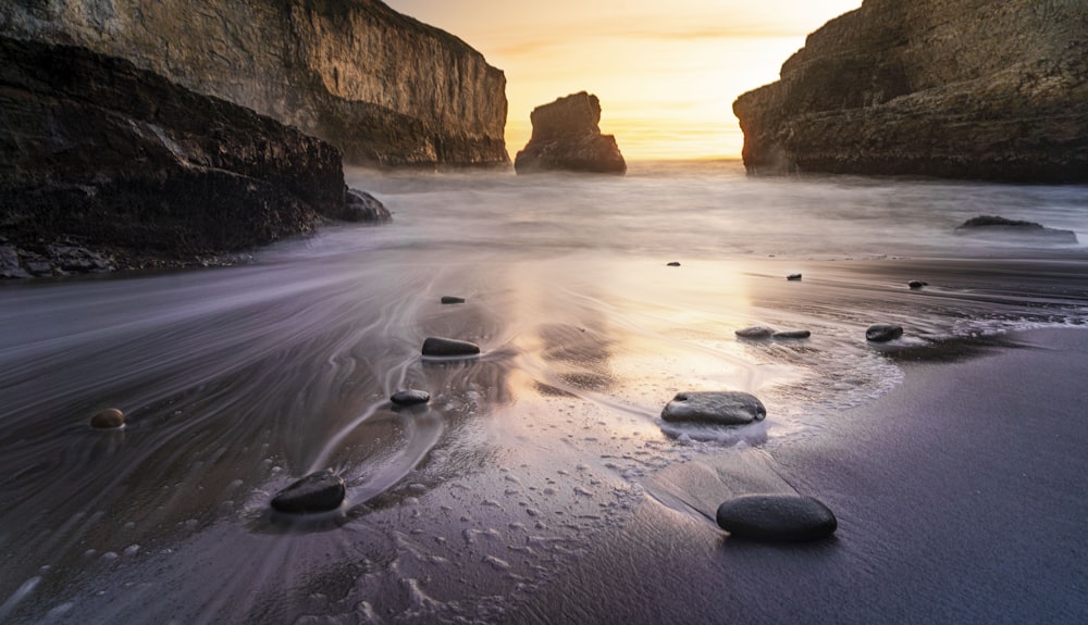 brown rock formation on sea shore during daytime