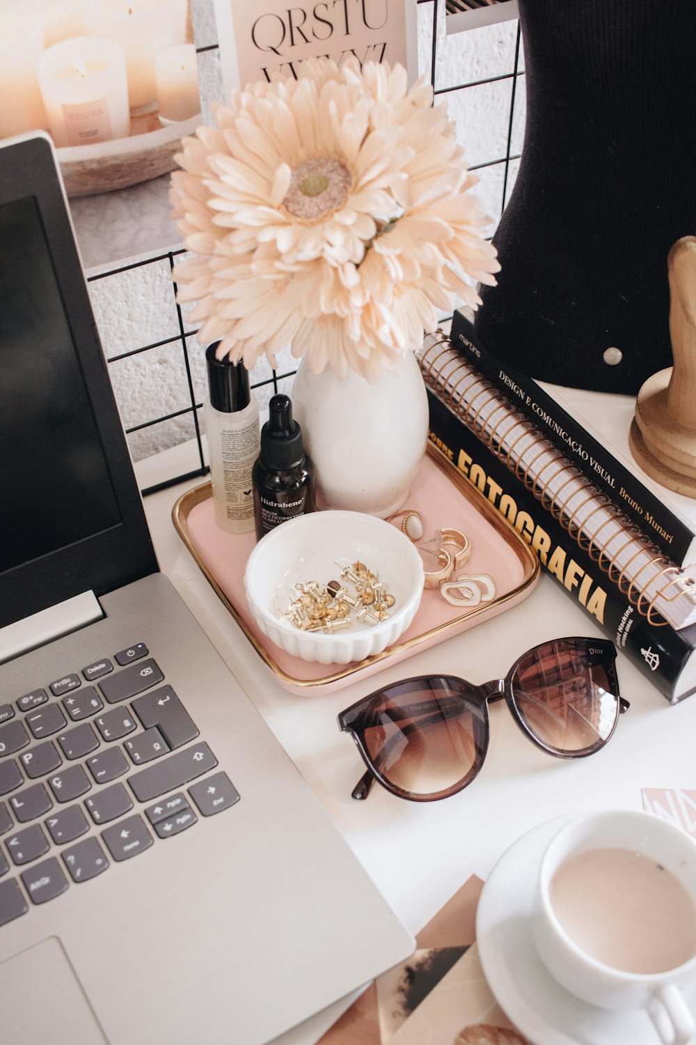 black framed sunglasses beside white flower