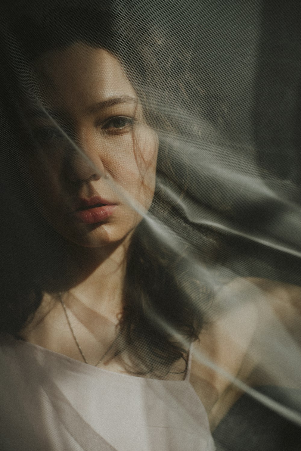 woman in white shirt with white veil