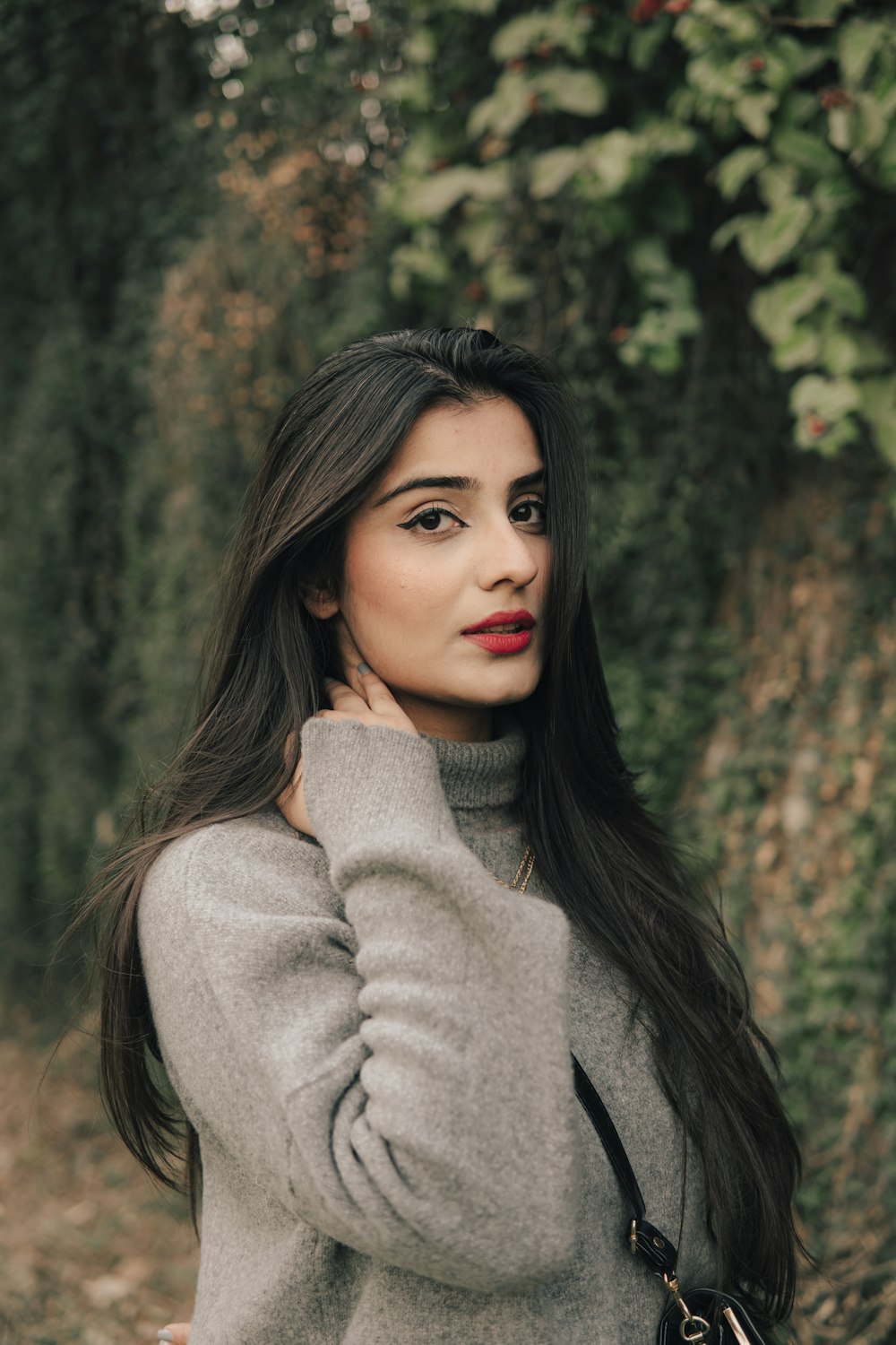 woman in gray turtleneck sweater