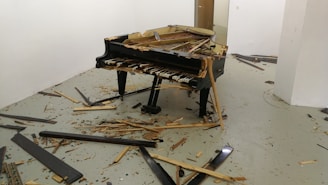 Before and after shots of a piano corner with chip restoration.