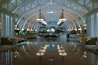 people walking inside building with glass walls