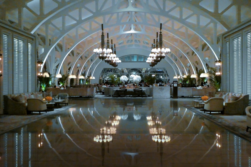 people walking inside building with glass walls