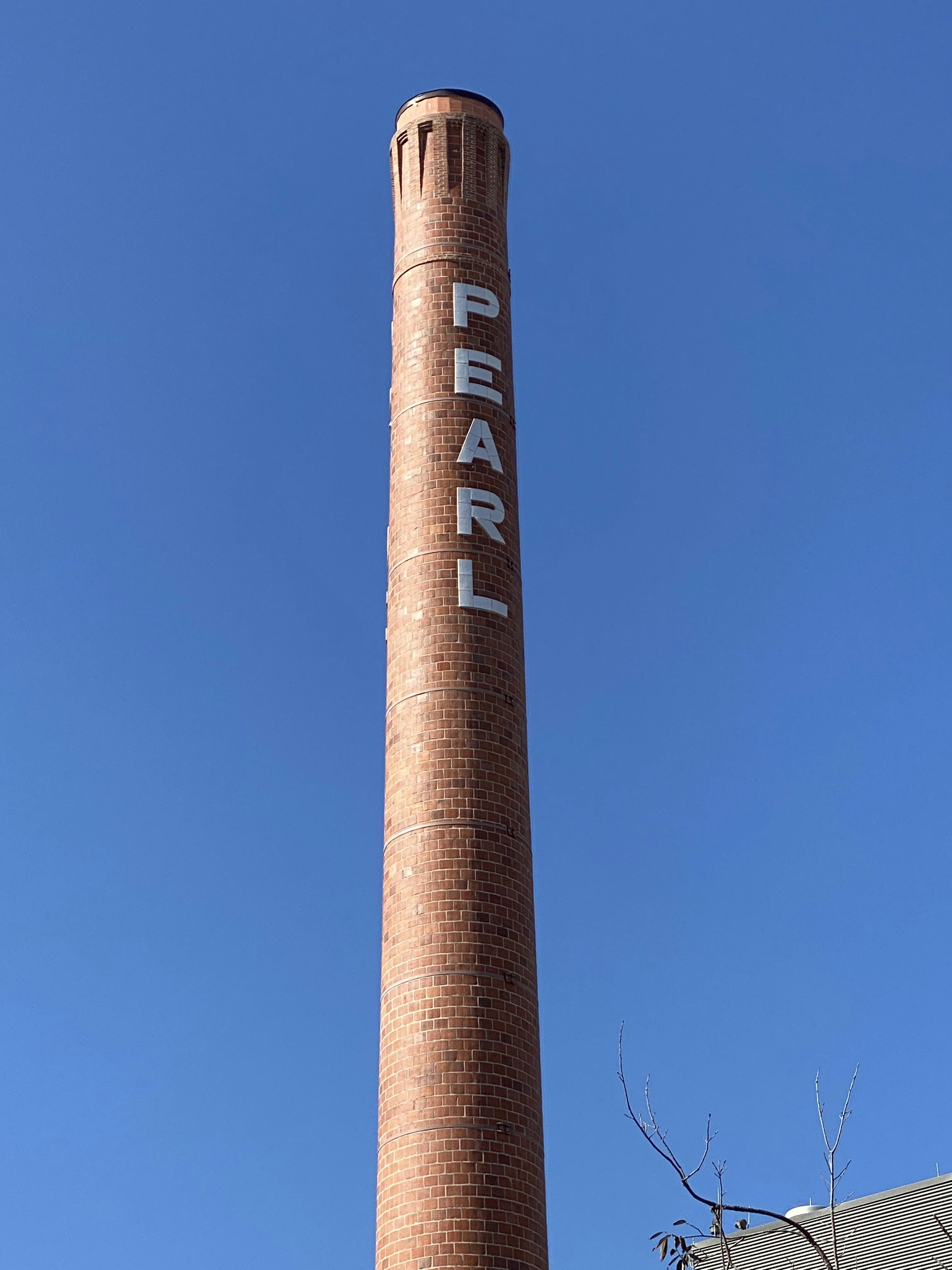 brown and white concrete tower under blue sky during daytime