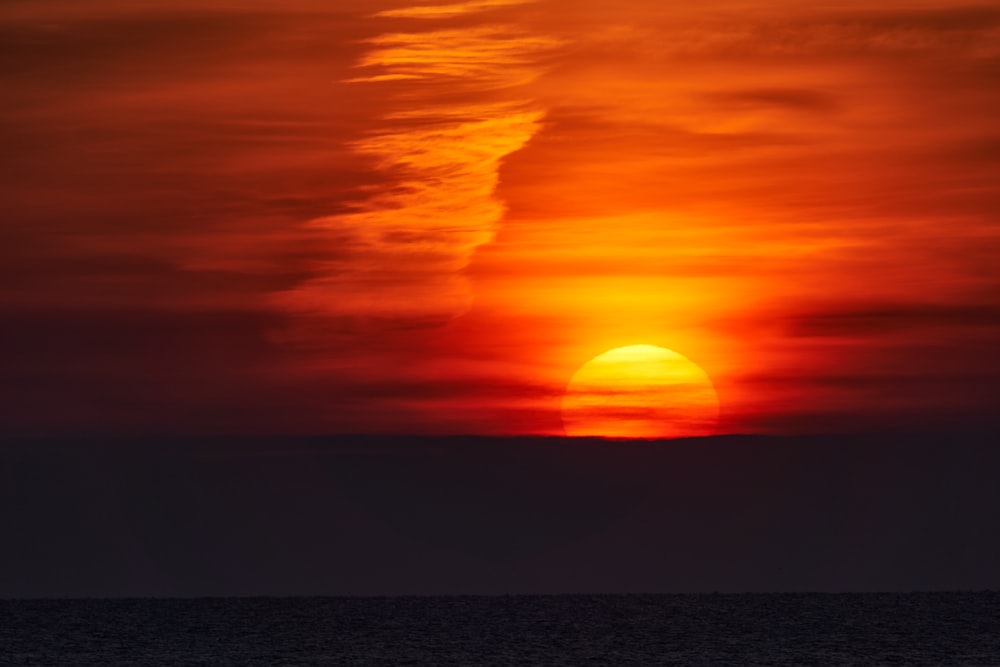 body of water during sunset