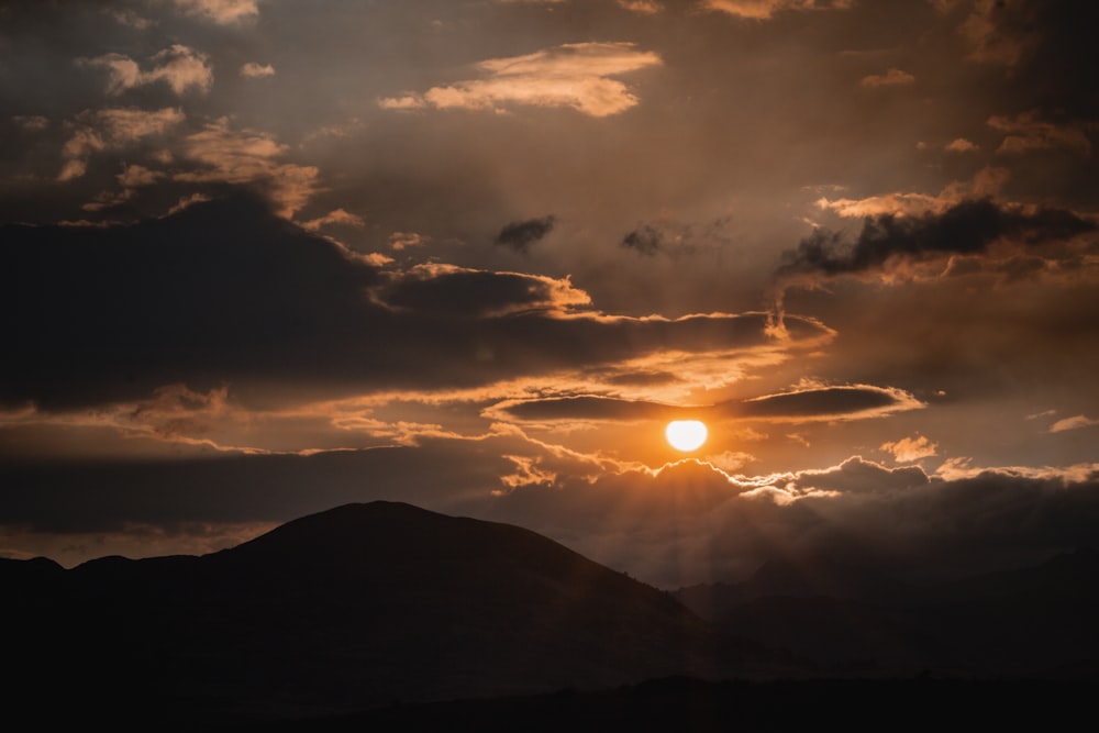 silhouette of mountains during sunset