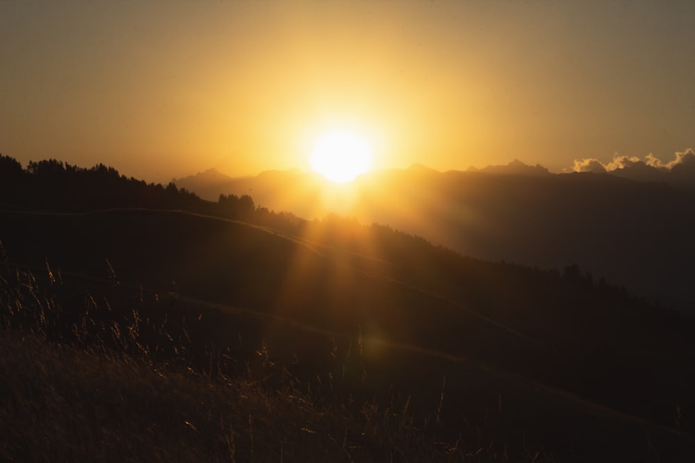 sun setting over the mountains