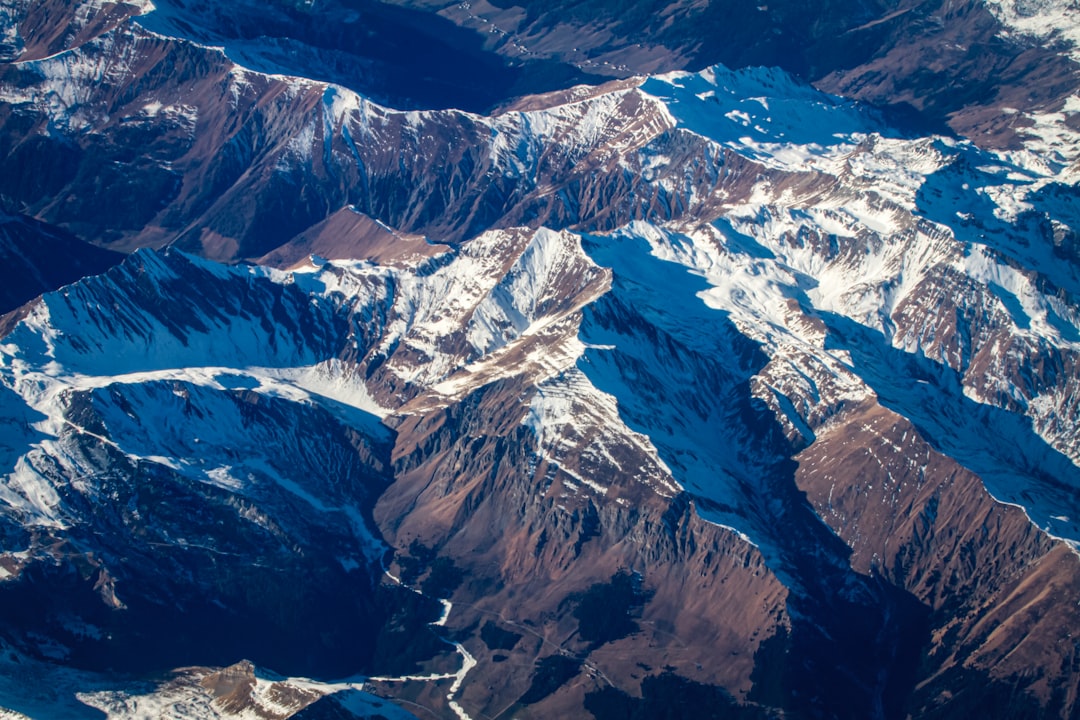 snow covered mountain during daytime