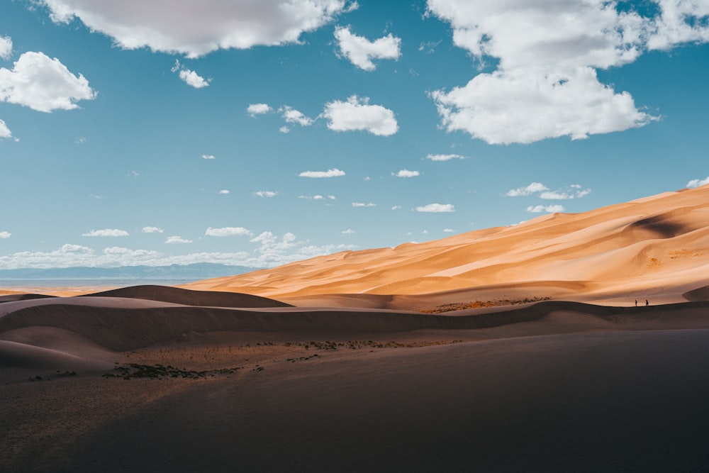 brown sand under blue sky during daytime