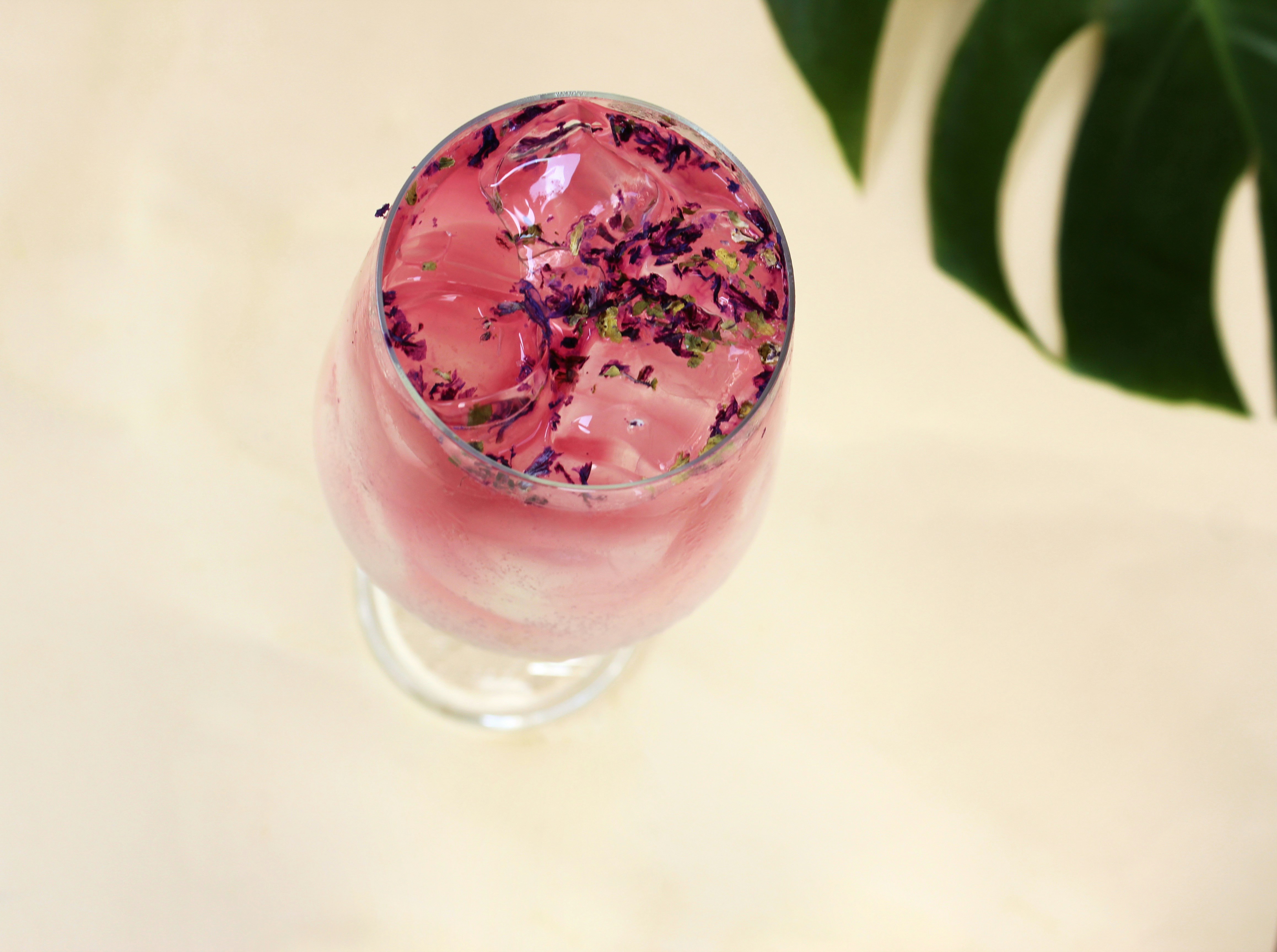 pink liquid in clear drinking glass