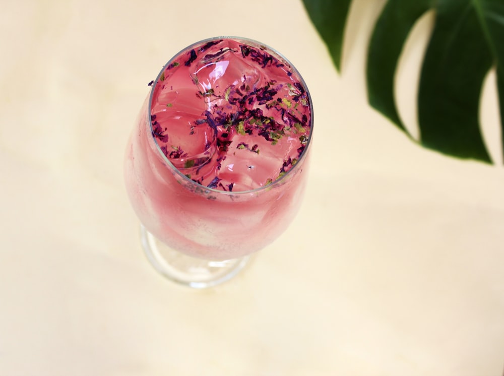 pink liquid in clear drinking glass