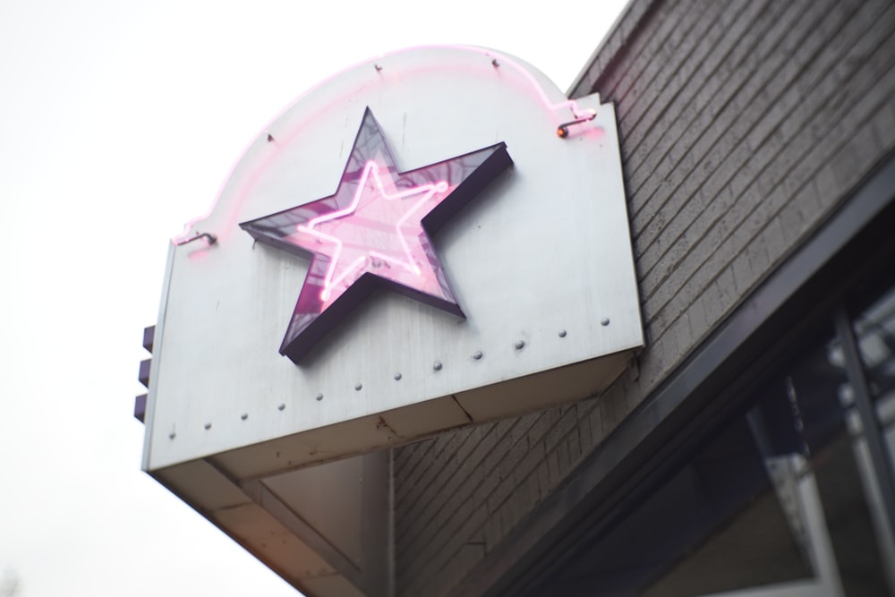 white and pink star print concrete building
