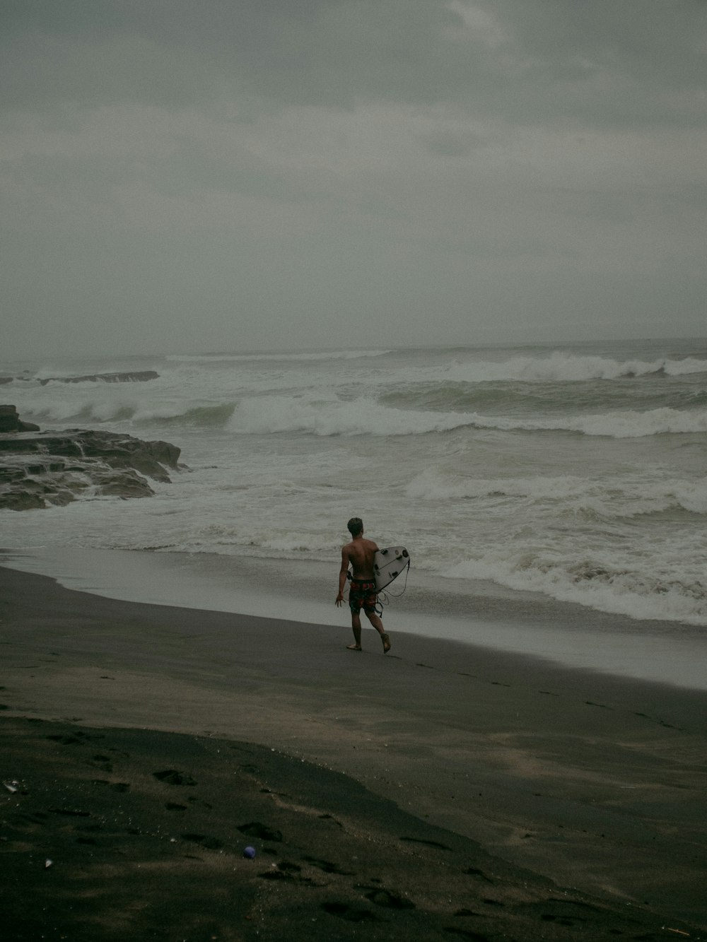 2 women walking on seashore during daytime