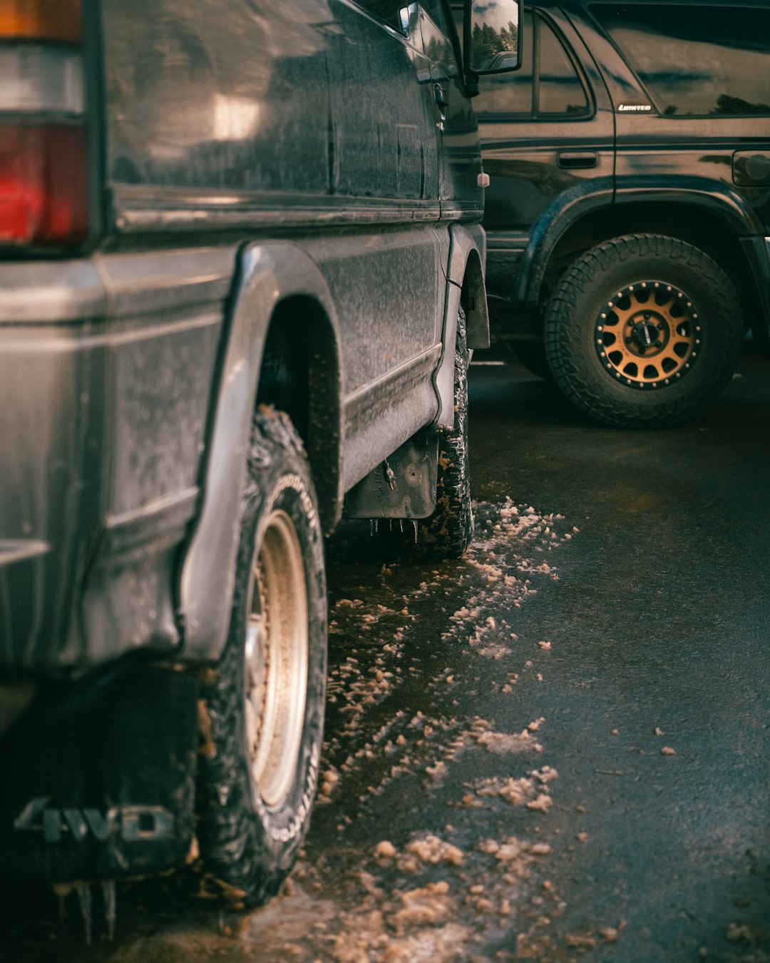 black suv on wet road