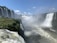 A breathtaking view of the Iguazu Falls surrounded by lush greenery.