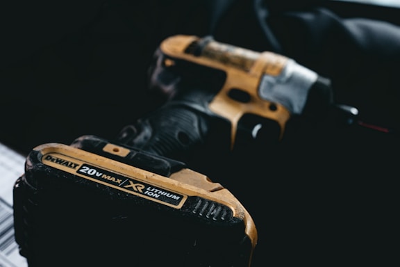 a pair of black and yellow tools sitting on top of a table