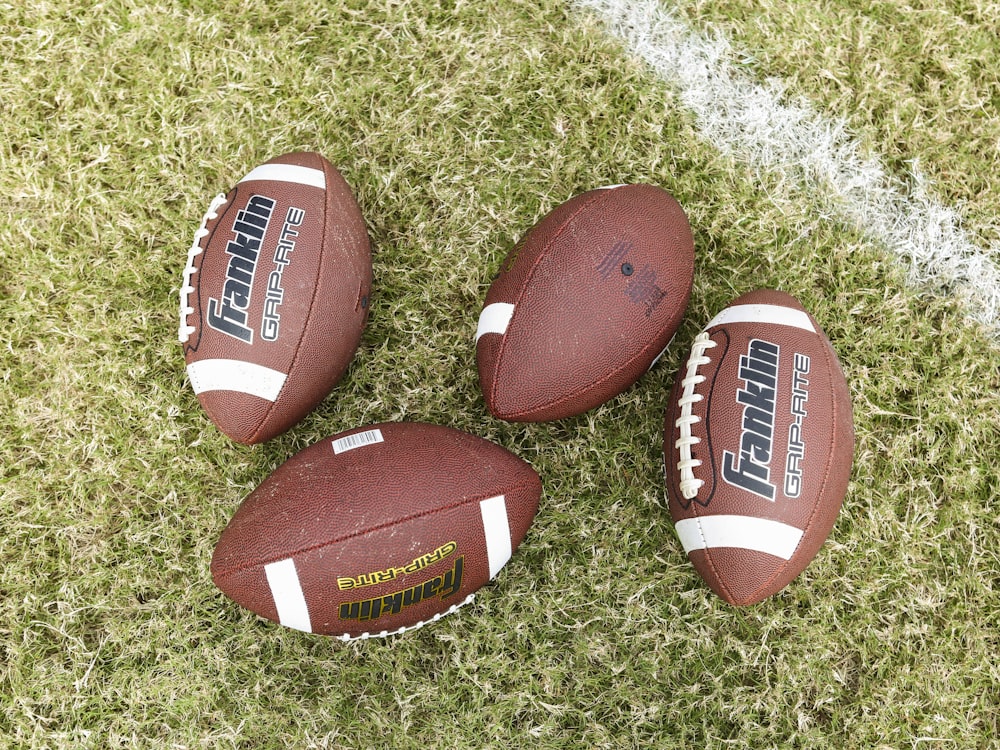 red and white football on green grass