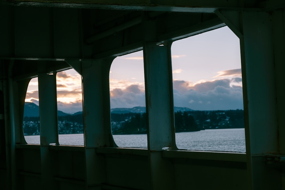 gray concrete bridge over the sea during daytime