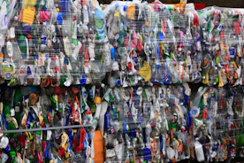 assorted clothes hanging on rack