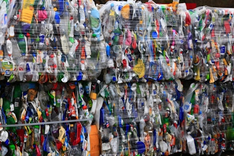 assorted clothes hanging on rack