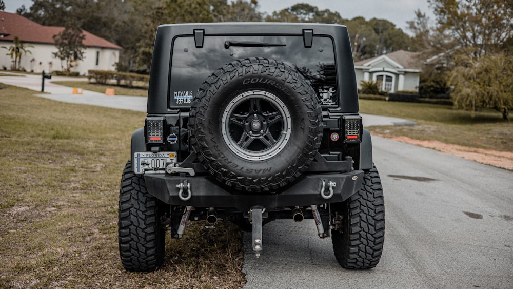 black off road car on road during daytime