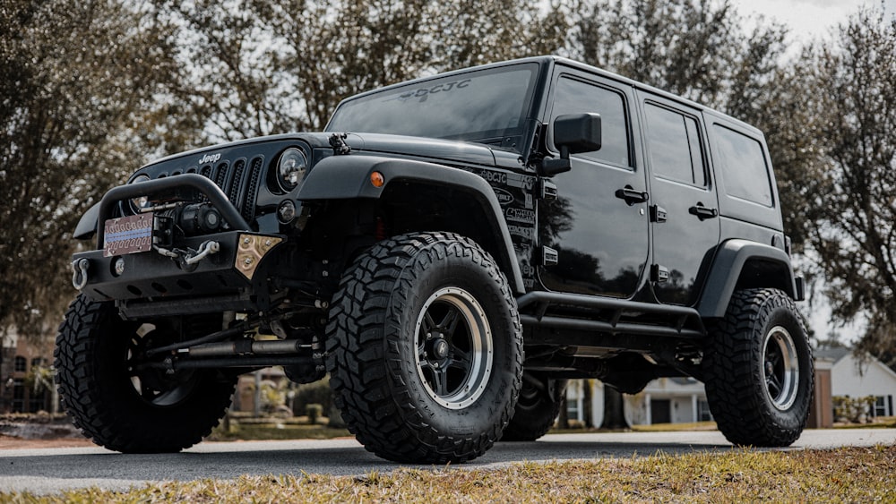 black jeep wrangler on road during daytime