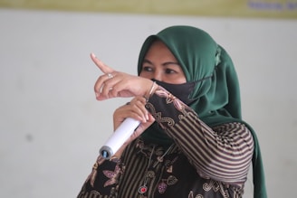 Dr. Fouzia Saeed speaking passionately on a cultural heritage TV program.